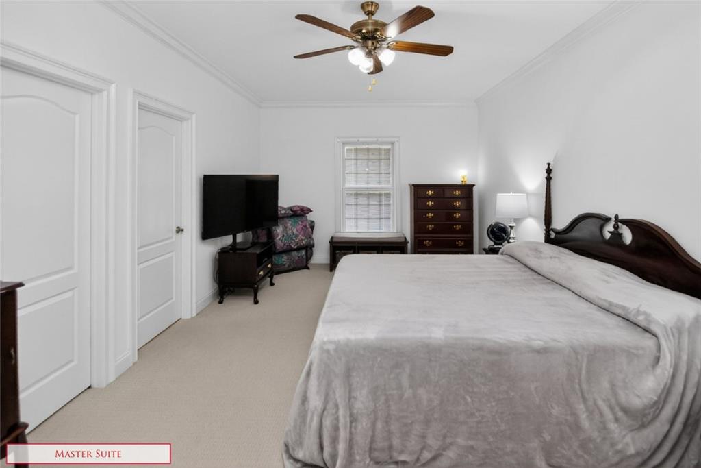 4113 Ledan Extension Gainesville, GA 30506 - Photo 105 of 195 a bedroom with a bed and a television