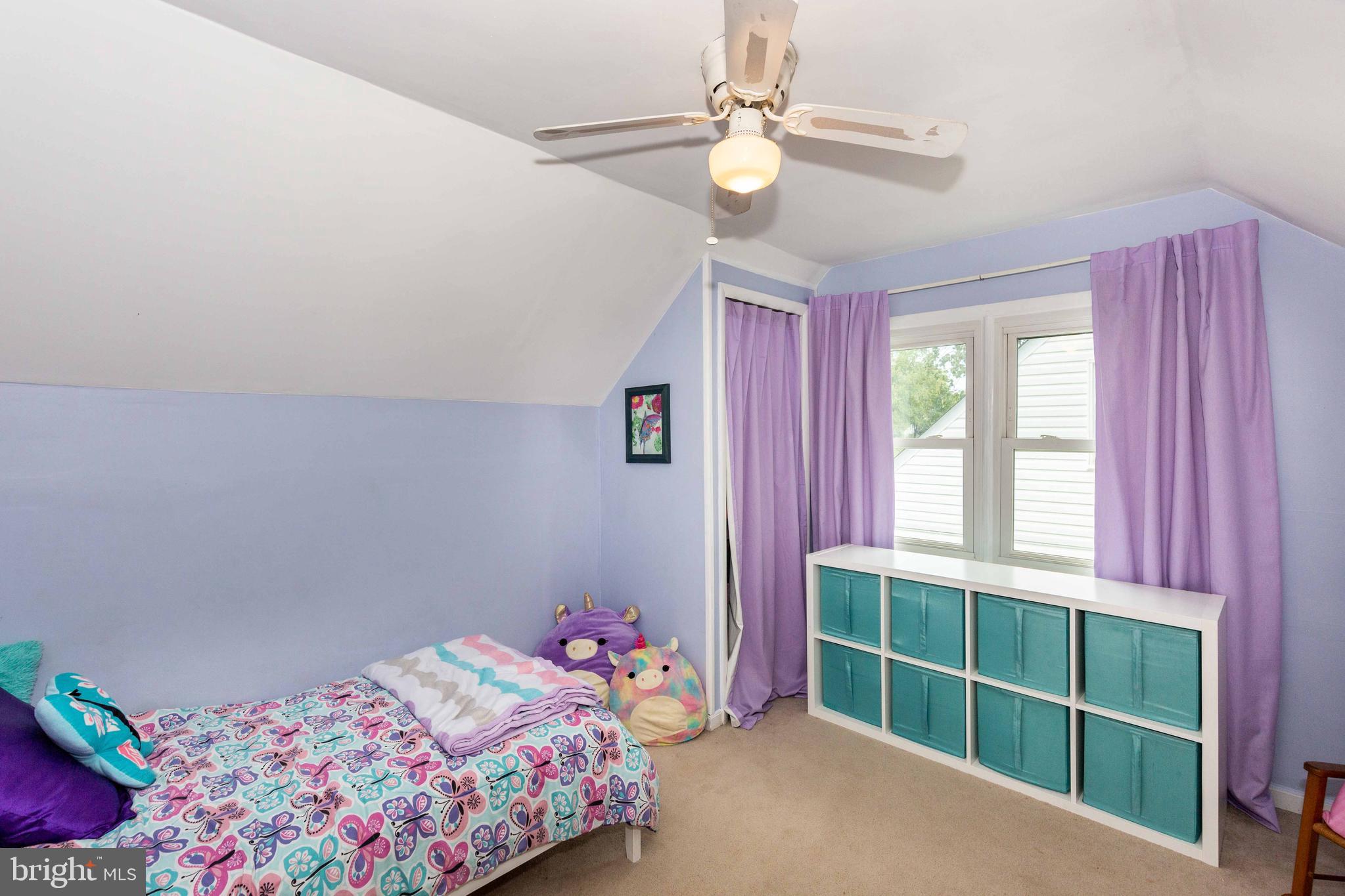 802 Templecliff Road Baltimore, MD 21208 - Photo 21 of 30 a bedroom with a bed and a window