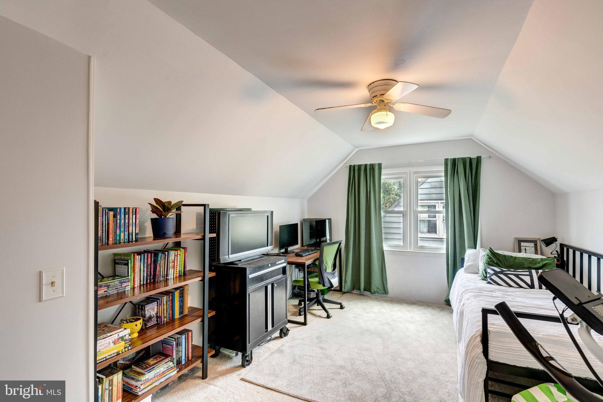 802 Templecliff Road Baltimore, MD 21208 - Photo 24 of 30 a view of a workspace with furniture and a bookshelf