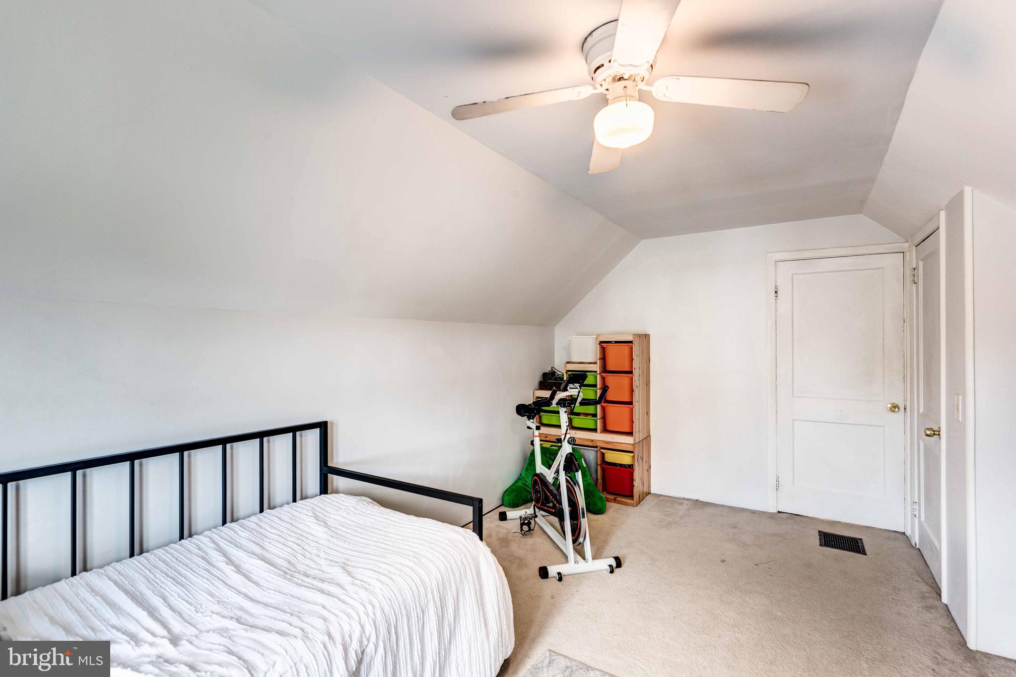 802 Templecliff Road Baltimore, MD 21208 - Photo 25 of 30 a bedroom with furniture and a chandelier