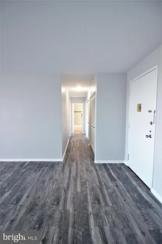 a view of a big room with wooden floor and closet