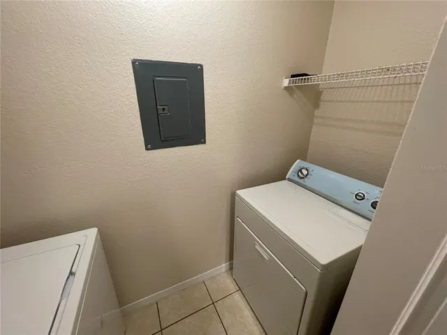 a view of backyard with patio