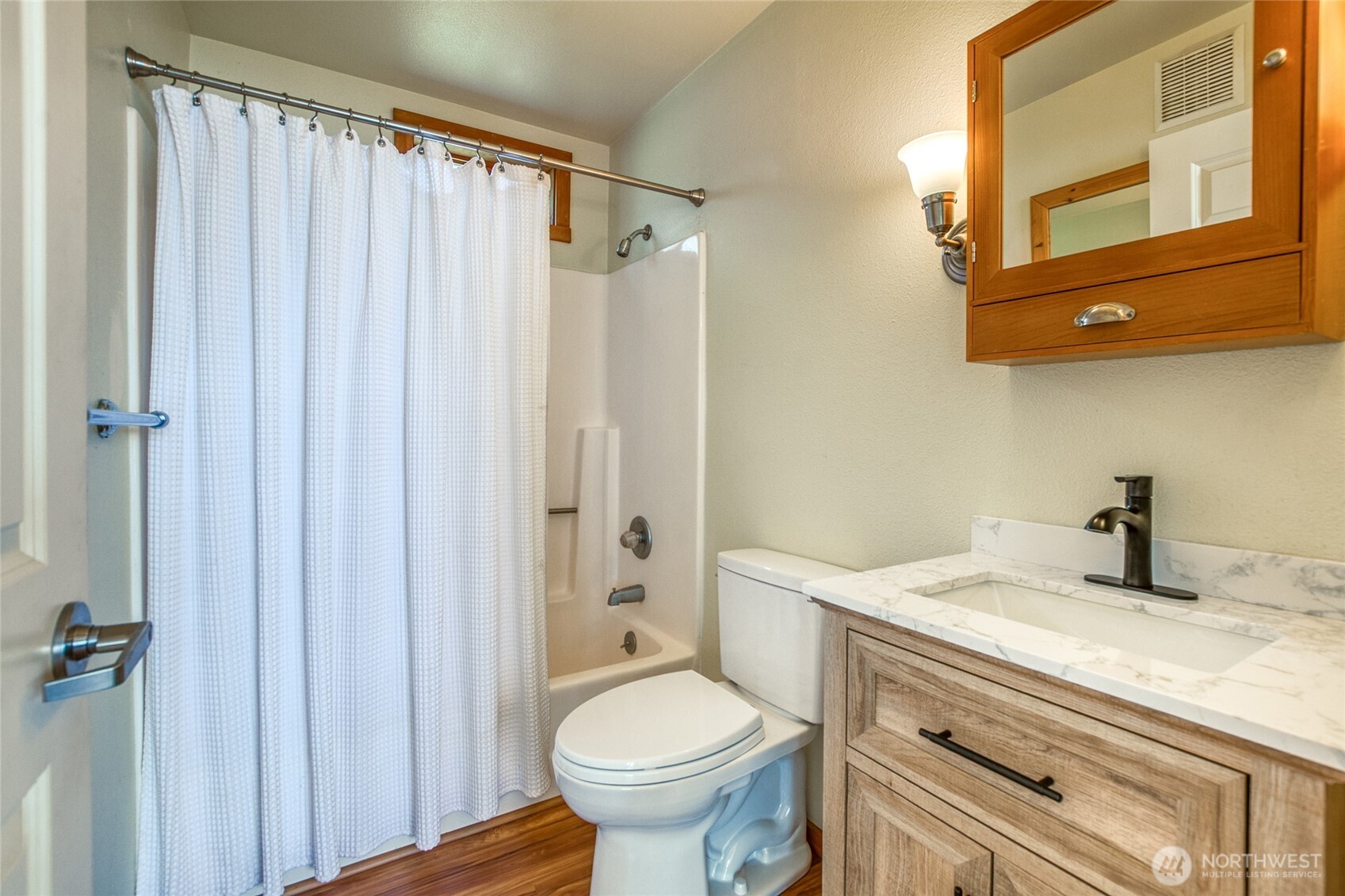 942 Deer Harbor Road Orcas Island, WA 98245 - Photo 8 of 40 a bathroom with a granite countertop sink toilet and shower