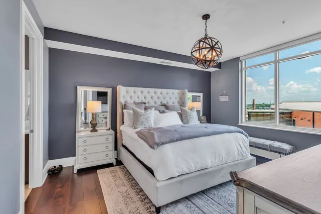 a bedroom with bed and window