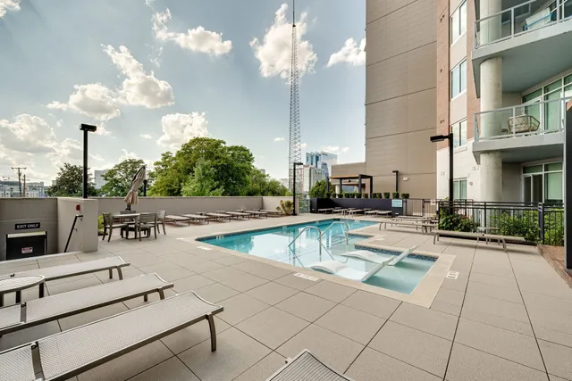 a view of a swimming pool with a lounge chairs