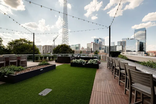 a view of a swimming pool and lounge chairs