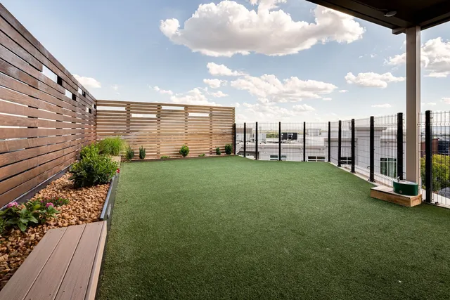 a view of a garden with an outdoor seating