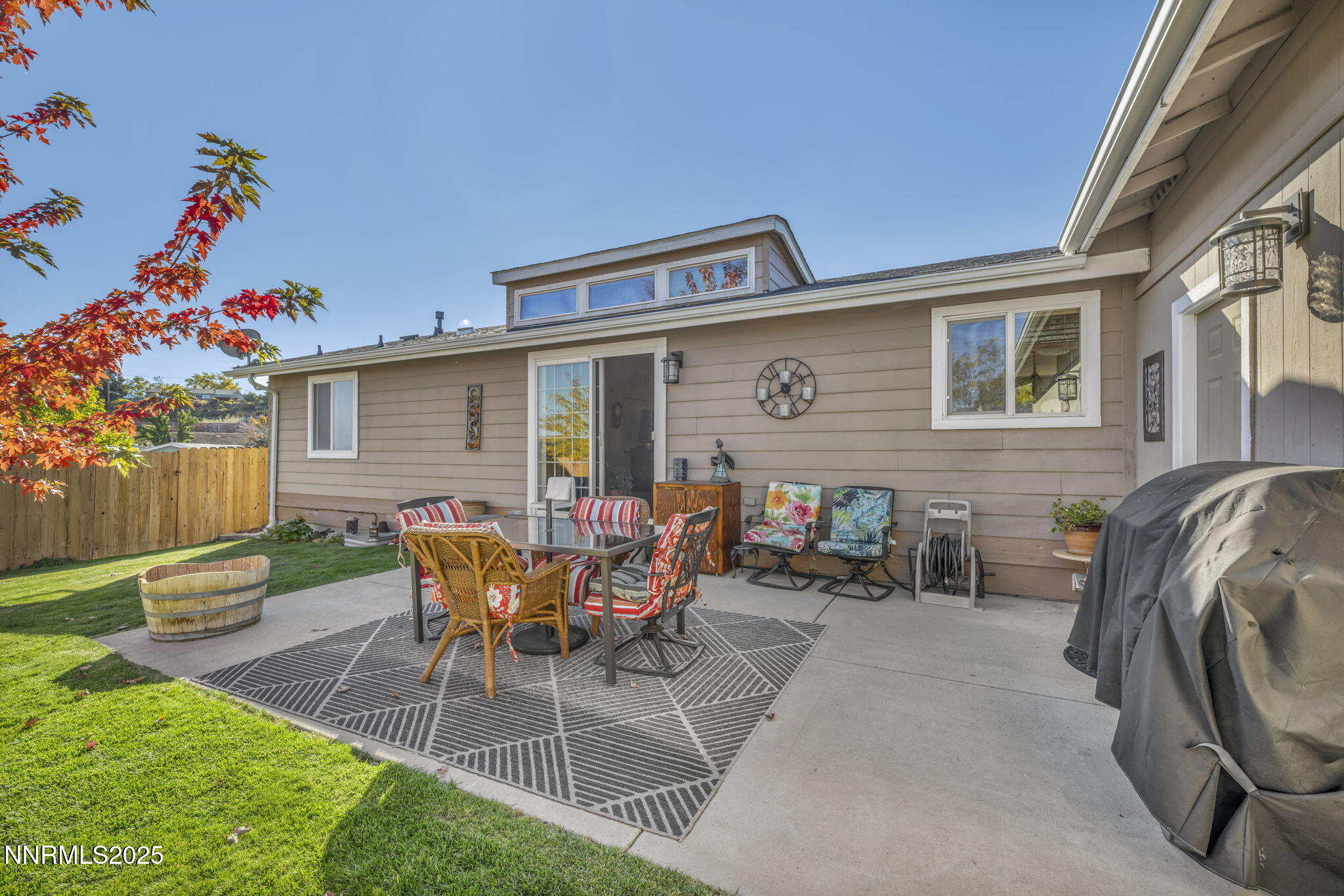 110 Platinum Pointe Way Reno, NV 89506 - Photo 13 of 39 a patio with table and chairs and potted plants