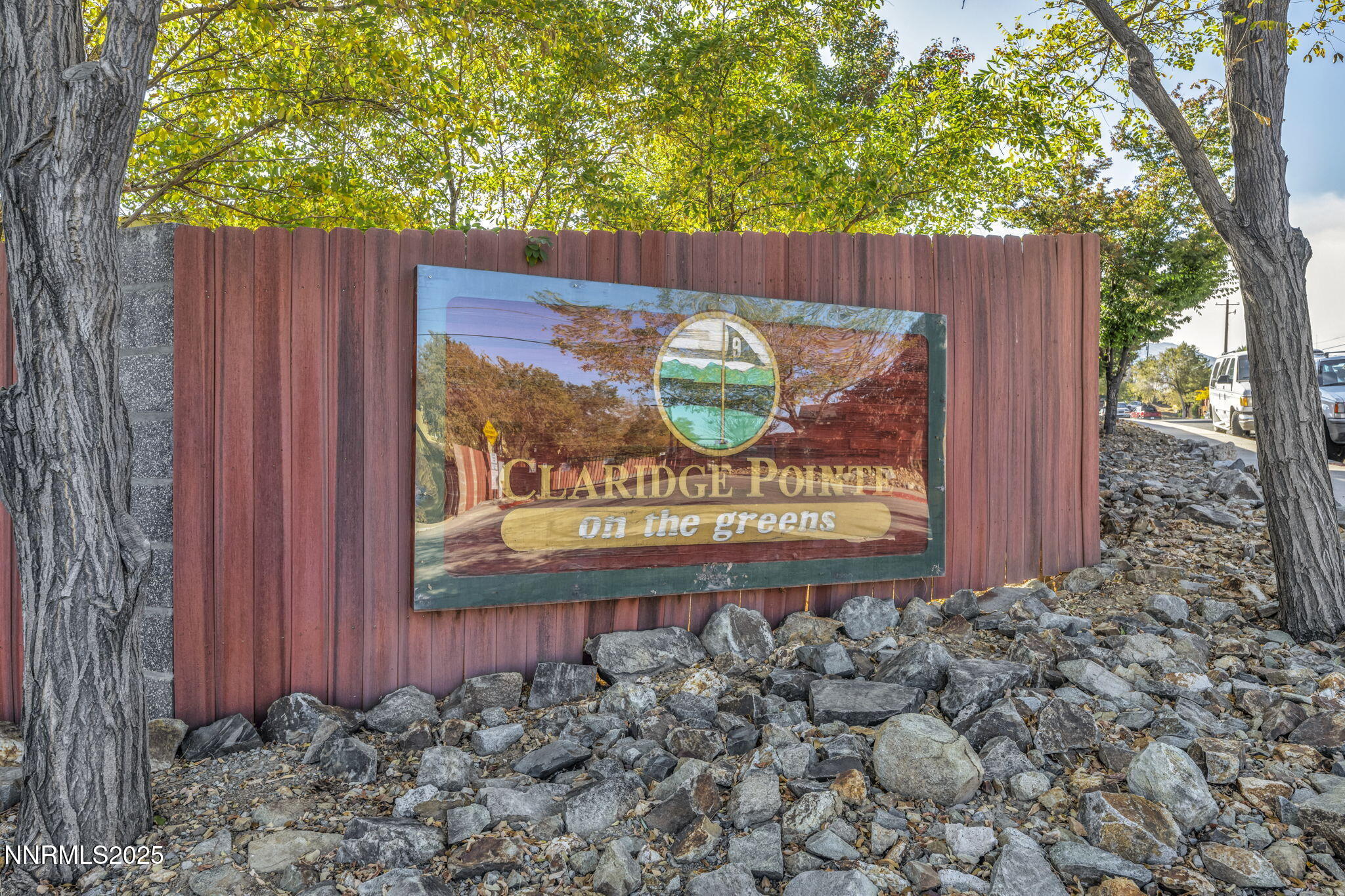 110 Platinum Pointe Way Reno, NV 89506 - Photo 15 of 39 a wooden sign that is on a brick wall
