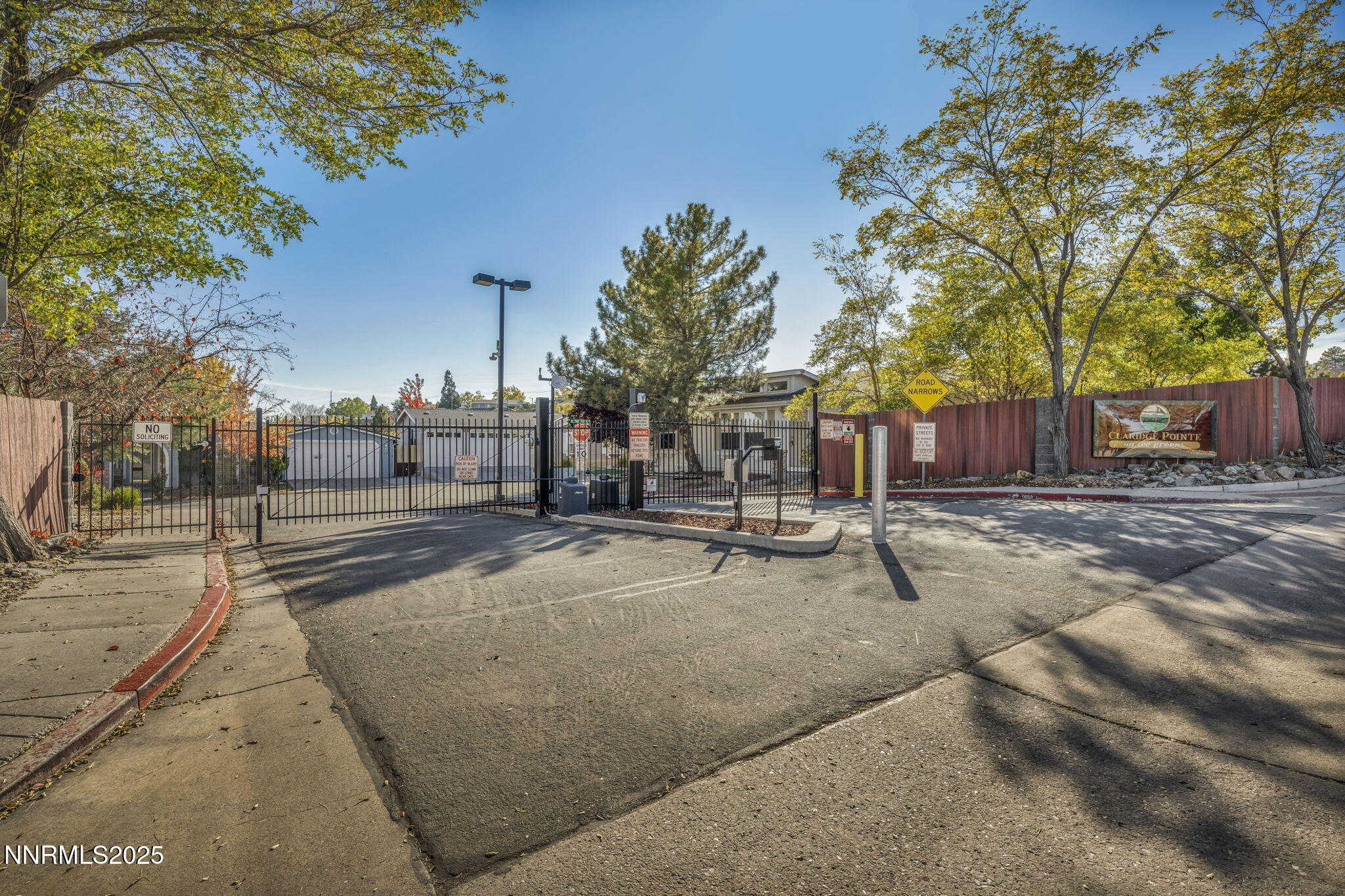 110 Platinum Pointe Way Reno, NV 89506 - Photo 16 of 39 a street view with large trees