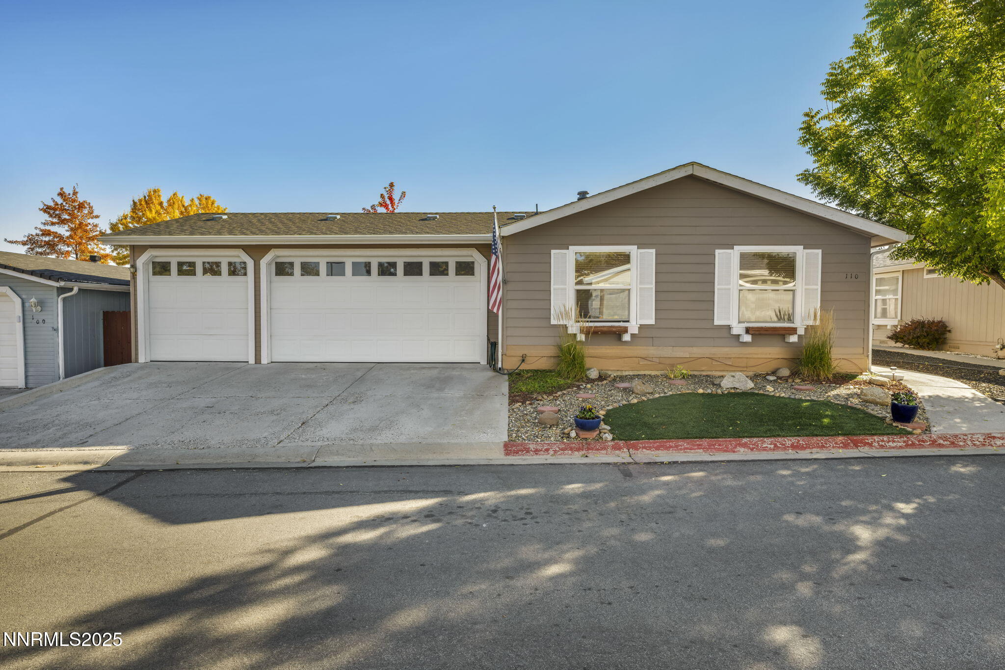 110 Platinum Pointe Way Reno, NV 89506 - Photo 2 of 39 a view of a house with a yard and potted plants
