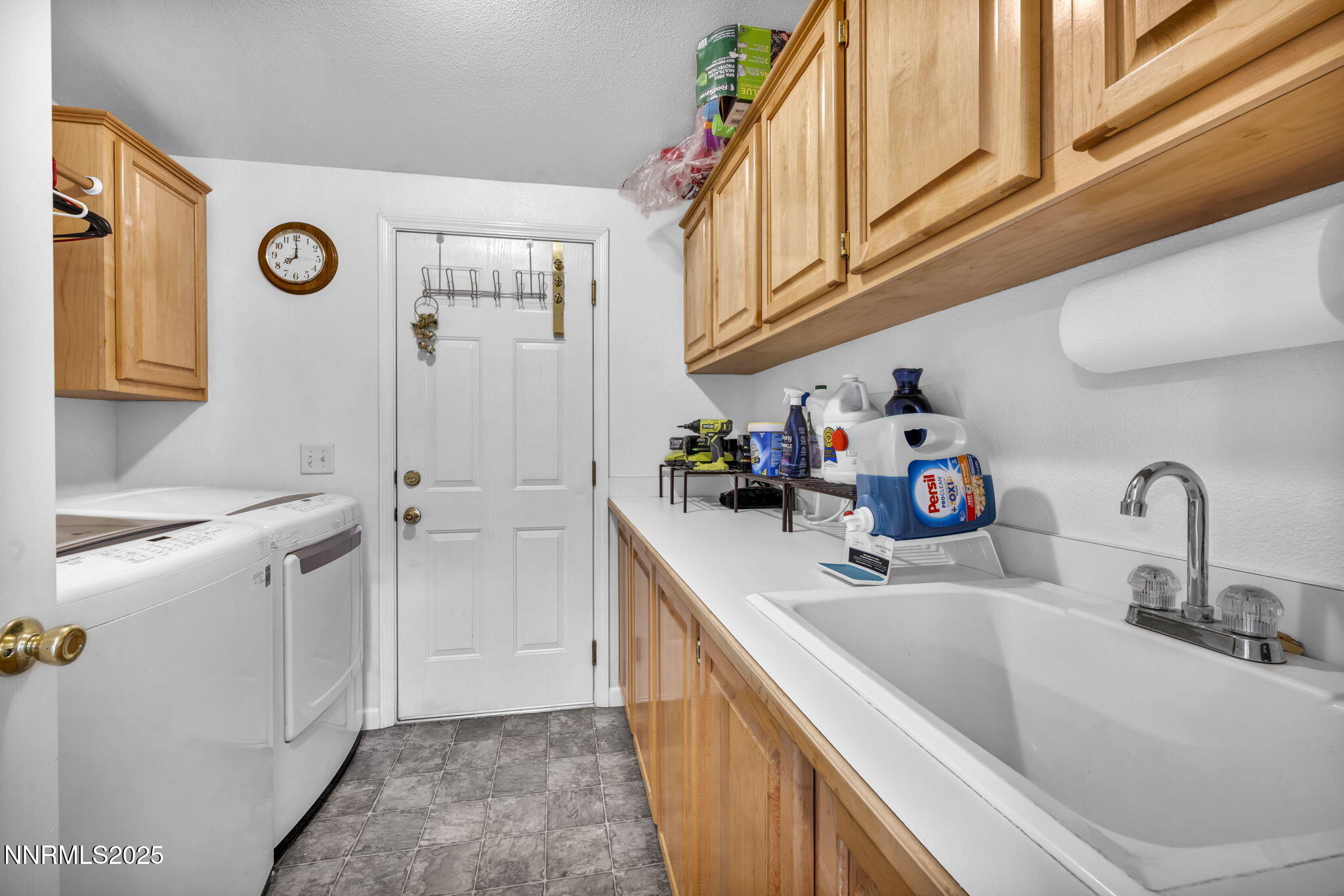 110 Platinum Pointe Way Reno, NV 89506 - Photo 22 of 39 a kitchen with stainless steel appliances granite countertop a sink and a refrigerator