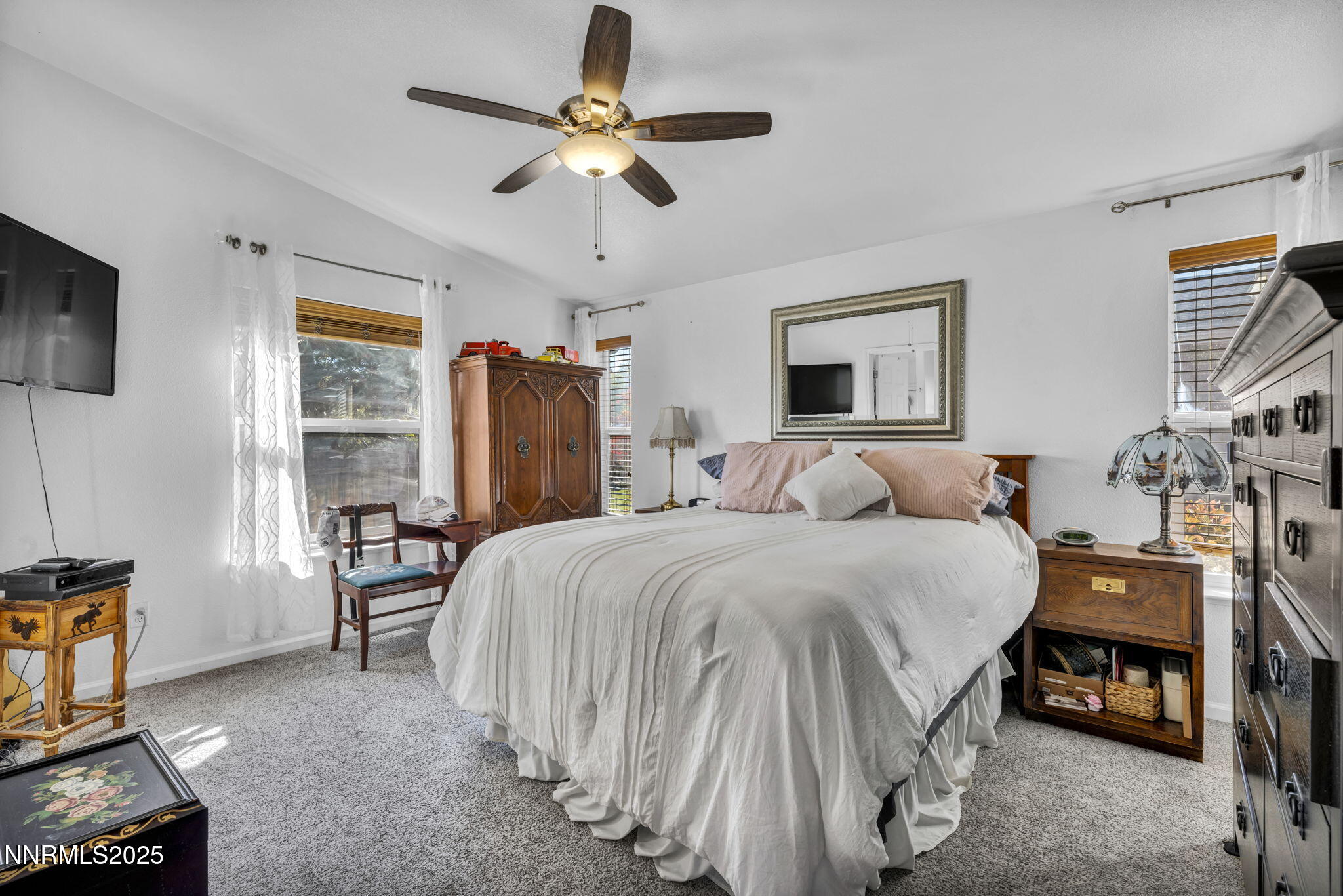 110 Platinum Pointe Way Reno, NV 89506 - Photo 24 of 39 a bed room with a bed and a tv