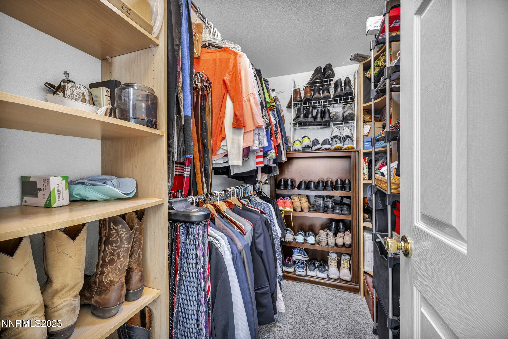 110 Platinum Pointe Way Reno, NV 89506 - Photo 25 of 39 a view of walk in closet with clothes and shoes