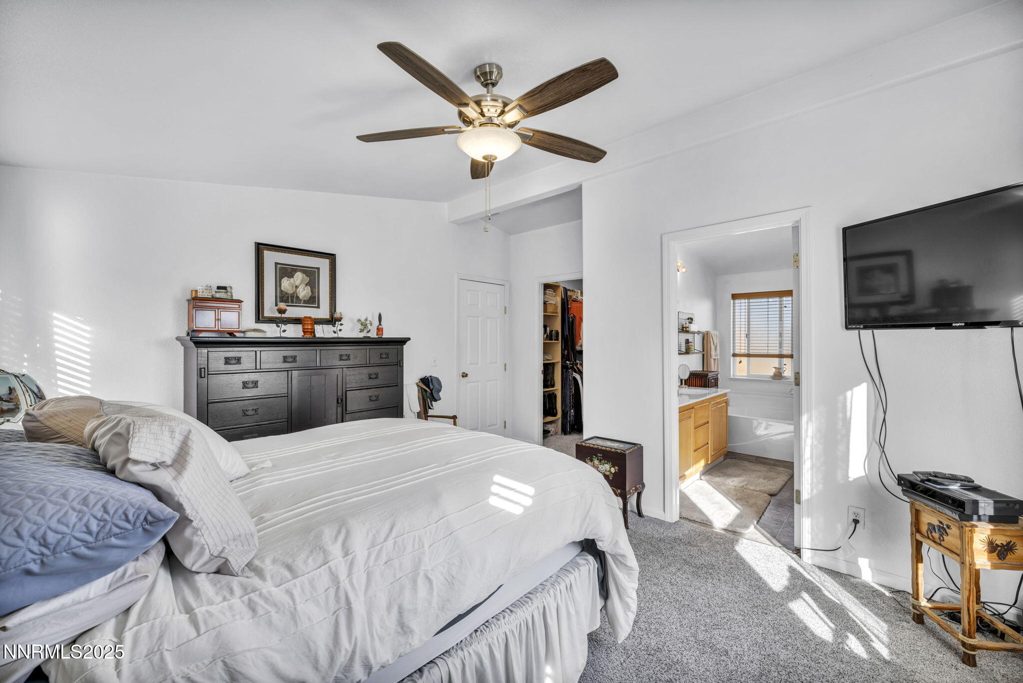 110 Platinum Pointe Way Reno, NV 89506 - Photo 27 of 39 a bedroom with a bed and a flat screen tv