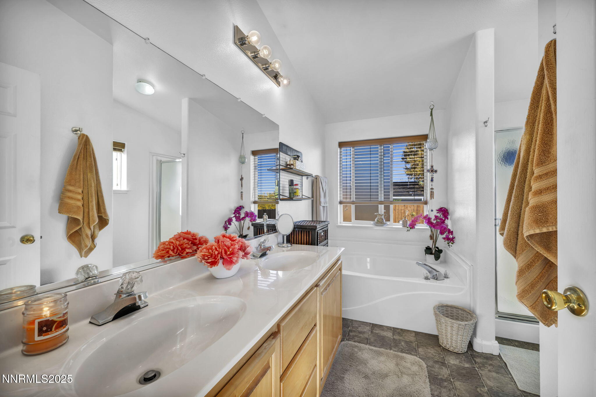 110 Platinum Pointe Way Reno, NV 89506 - Photo 28 of 39 a bathroom with a tub sink and mirror
