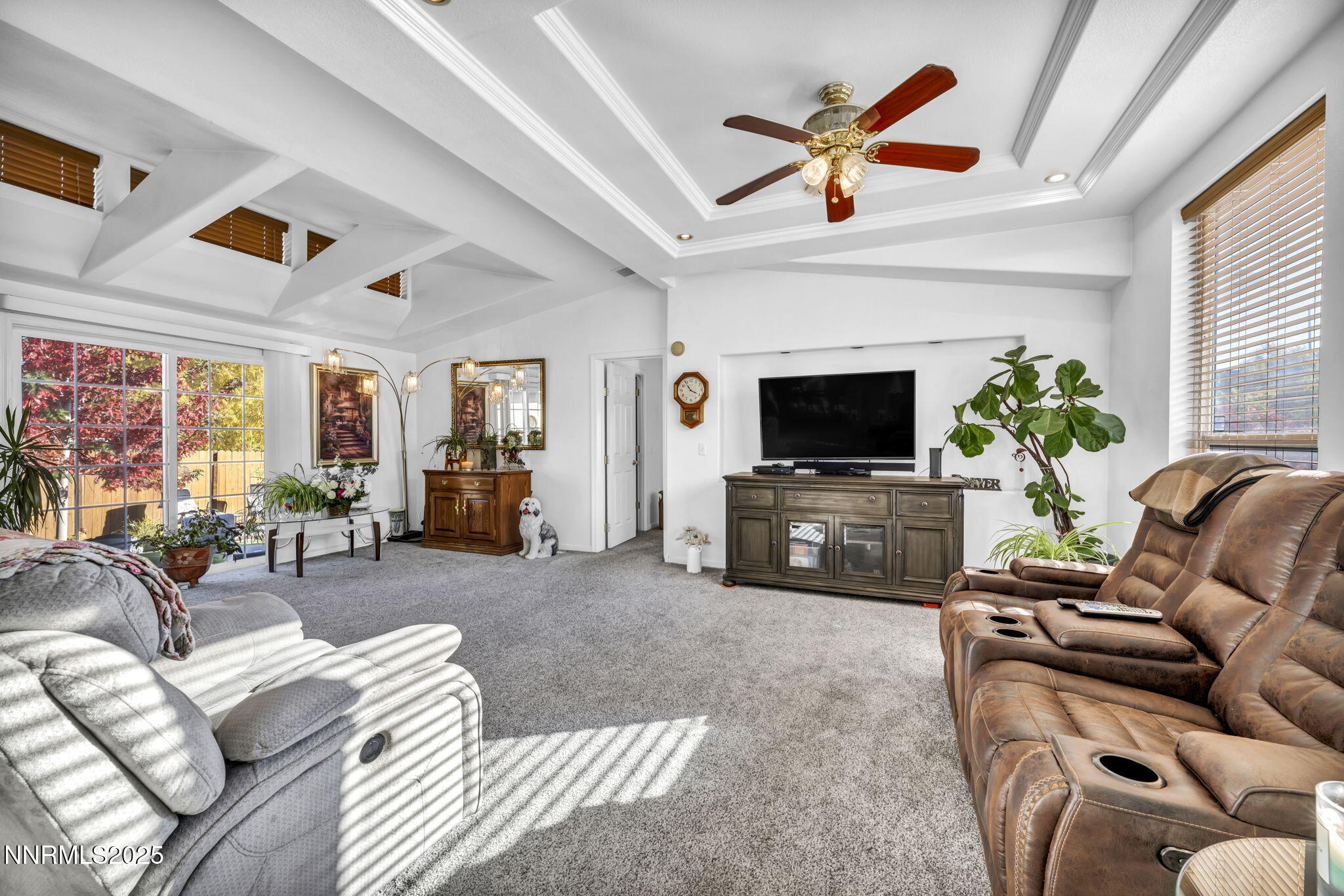 110 Platinum Pointe Way Reno, NV 89506 - Photo 32 of 39 a living room with furniture a flat screen tv and a window