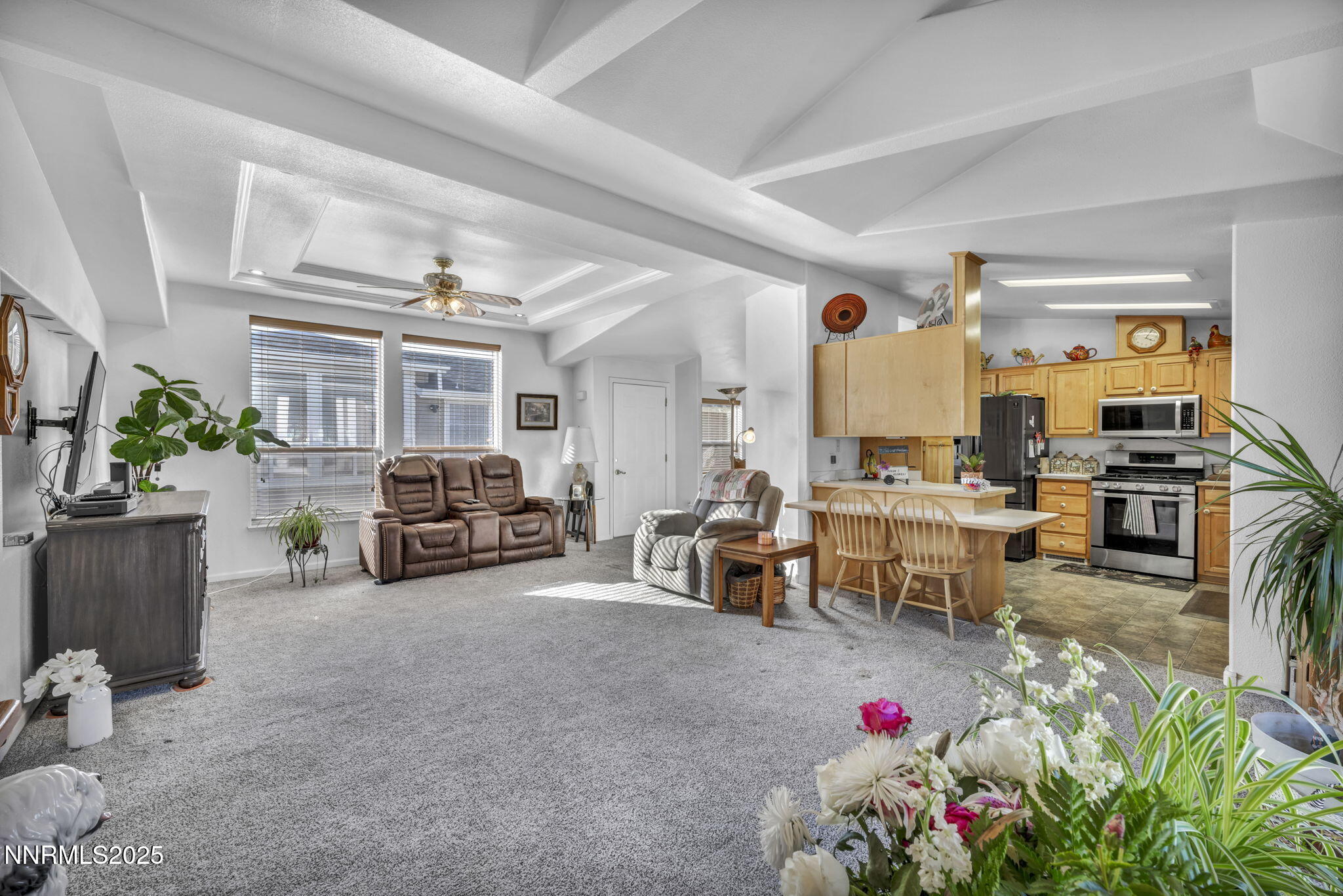 110 Platinum Pointe Way Reno, NV 89506 - Photo 35 of 39 a living room with furniture and a dining table with rug kitchen