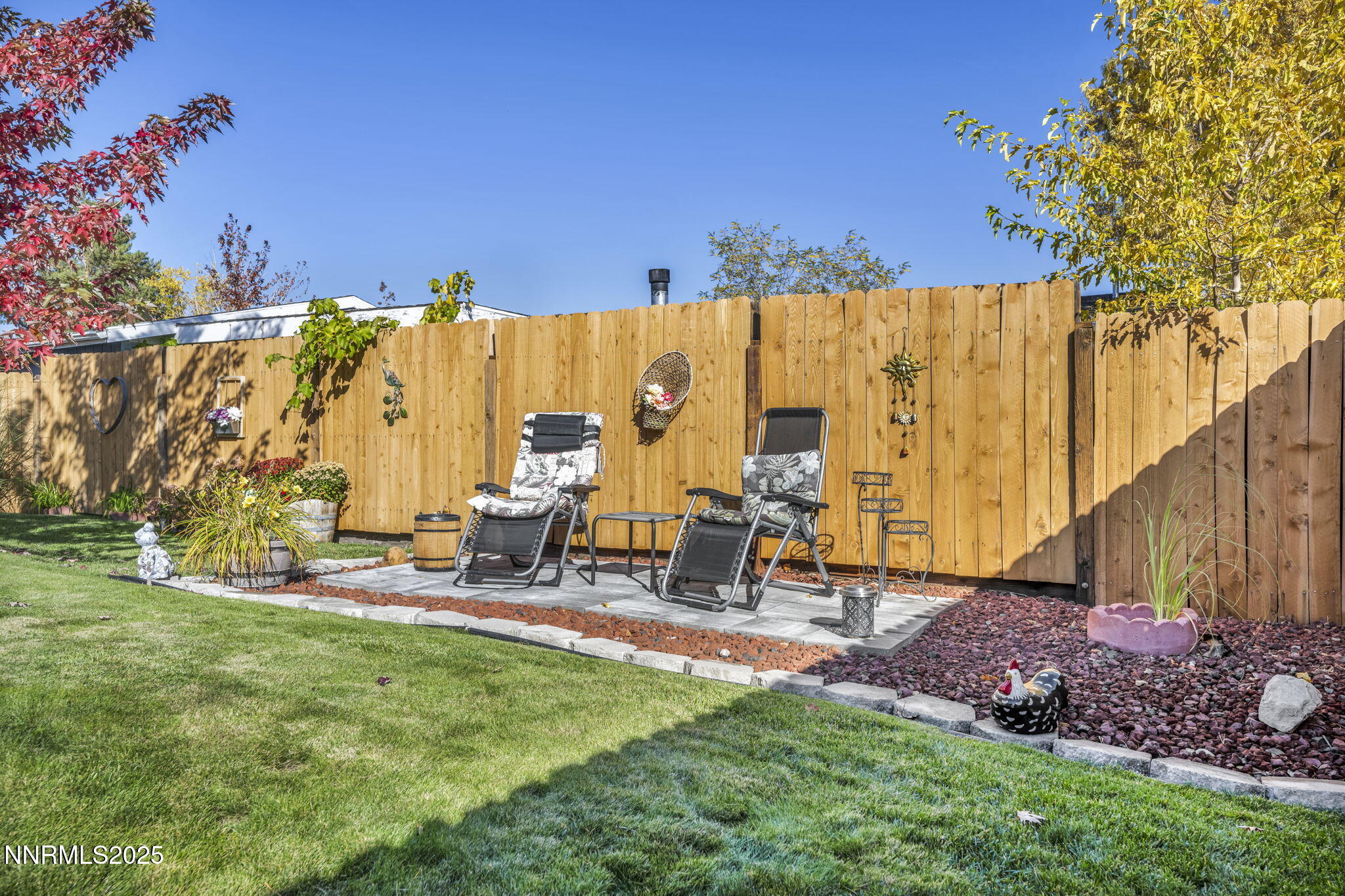 110 Platinum Pointe Way Reno, NV 89506 - Photo 6 of 39 a view of backyard with a table and chairs
