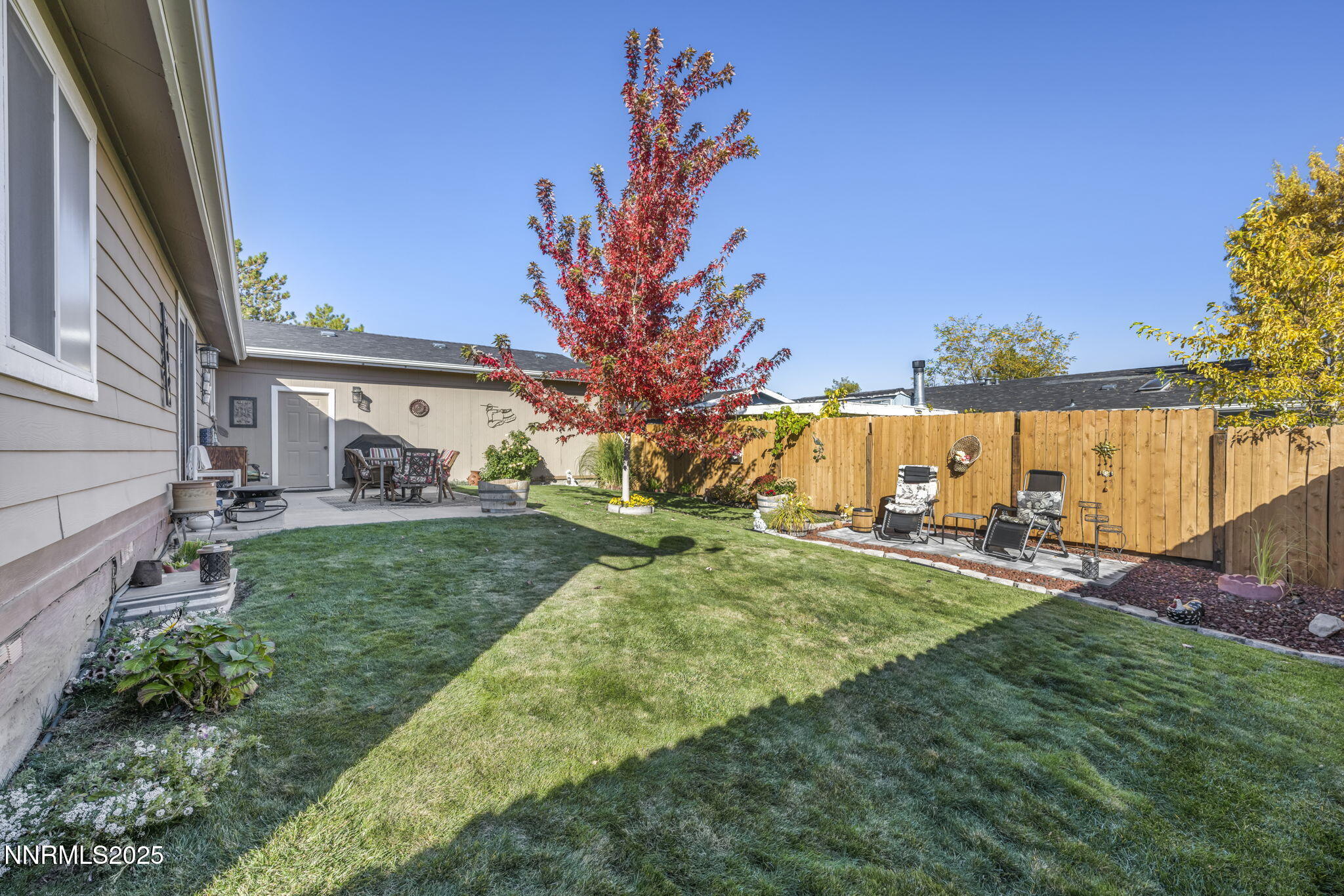 110 Platinum Pointe Way Reno, NV 89506 - Photo 7 of 39 a view of a house with a yard