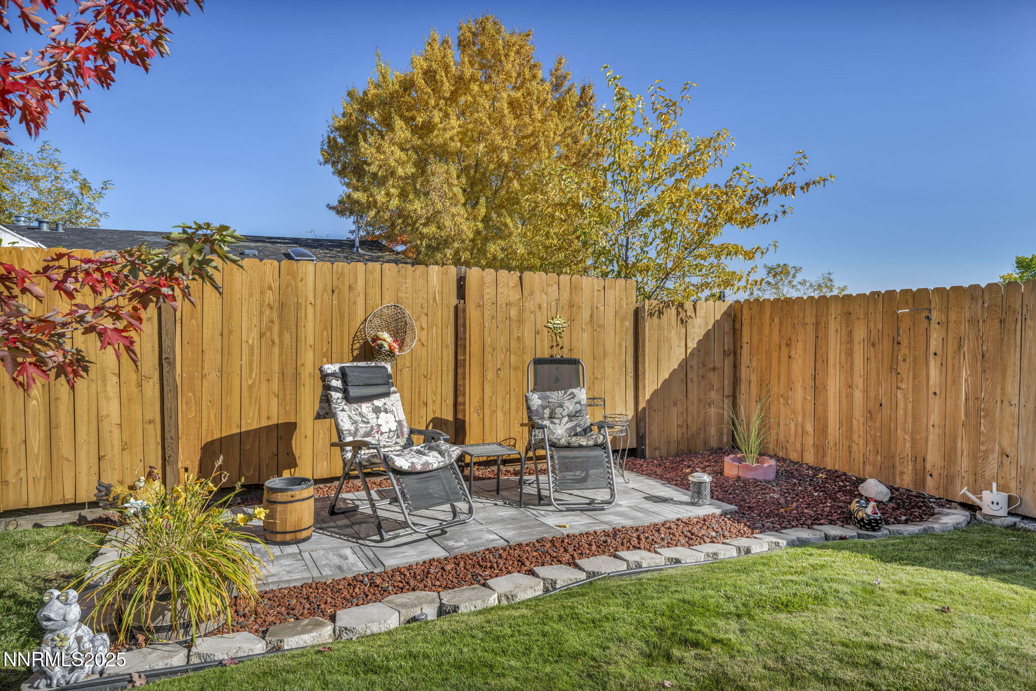 110 Platinum Pointe Way Reno, NV 89506 - Photo 9 of 39 a view of backyard with wheel chair and potted plants