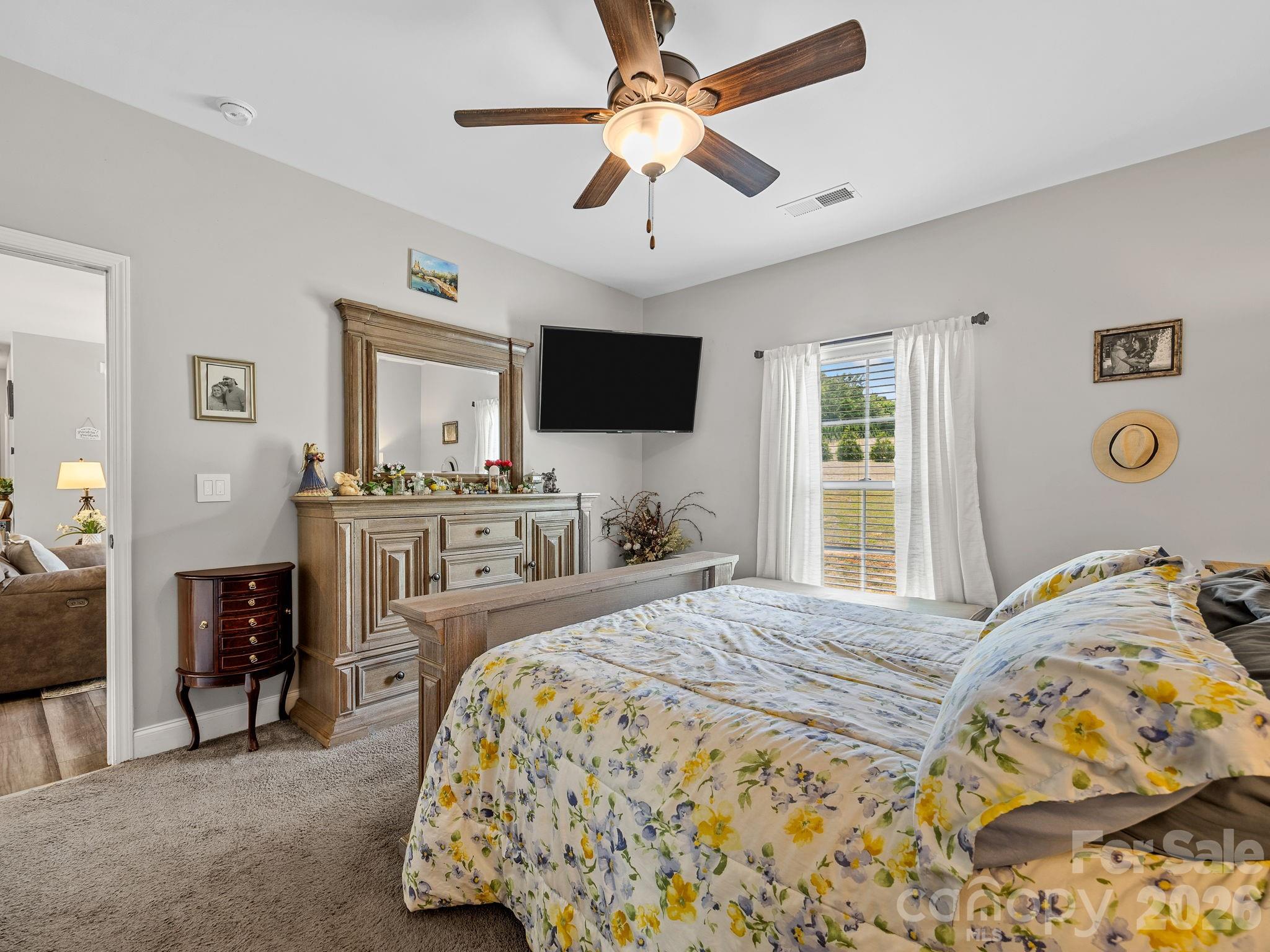 1076 McSwain Road Chesnee, SC 29323 - Photo 19 of 36 a bedroom with a bed and a flat screen tv