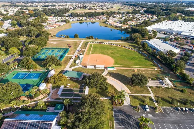 an aerial view of residential house with outdoor space and swimming pool