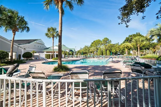a view of a house with backyard porch and sitting area