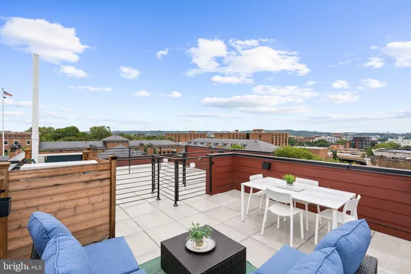 a view of a terrace with furniture