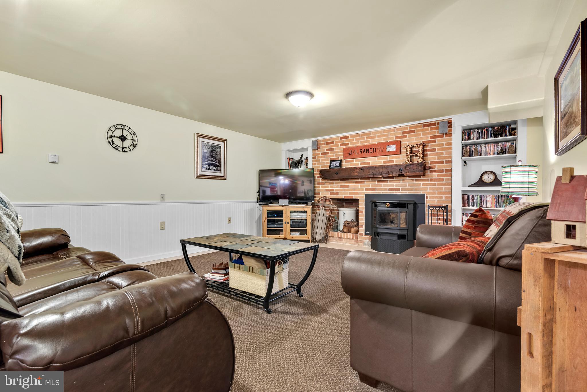 913 Quarry Road Perkasie, PA 18944 - Photo 24 of 35 Finished basement with Pellet stove