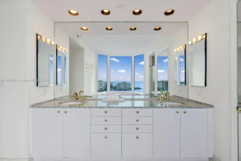 a white bath tub sitting in a en suite bathroom