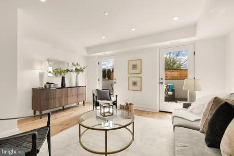 a living room with furniture and a table