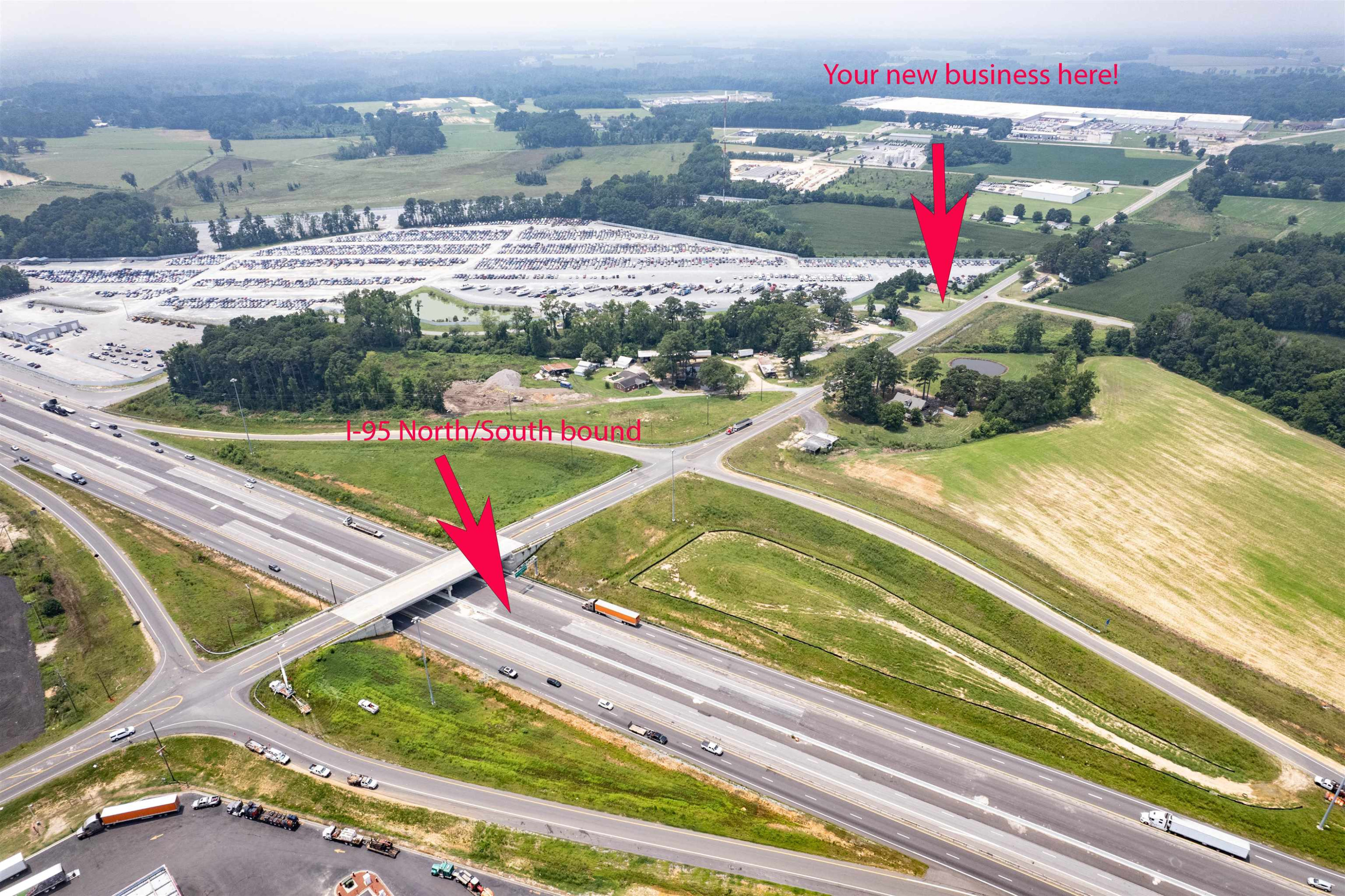 528 Long Branch Road Dunn, NC 28334 - Photo 1 of 27 an aerial view of a tennis ground and a cars park side of a road