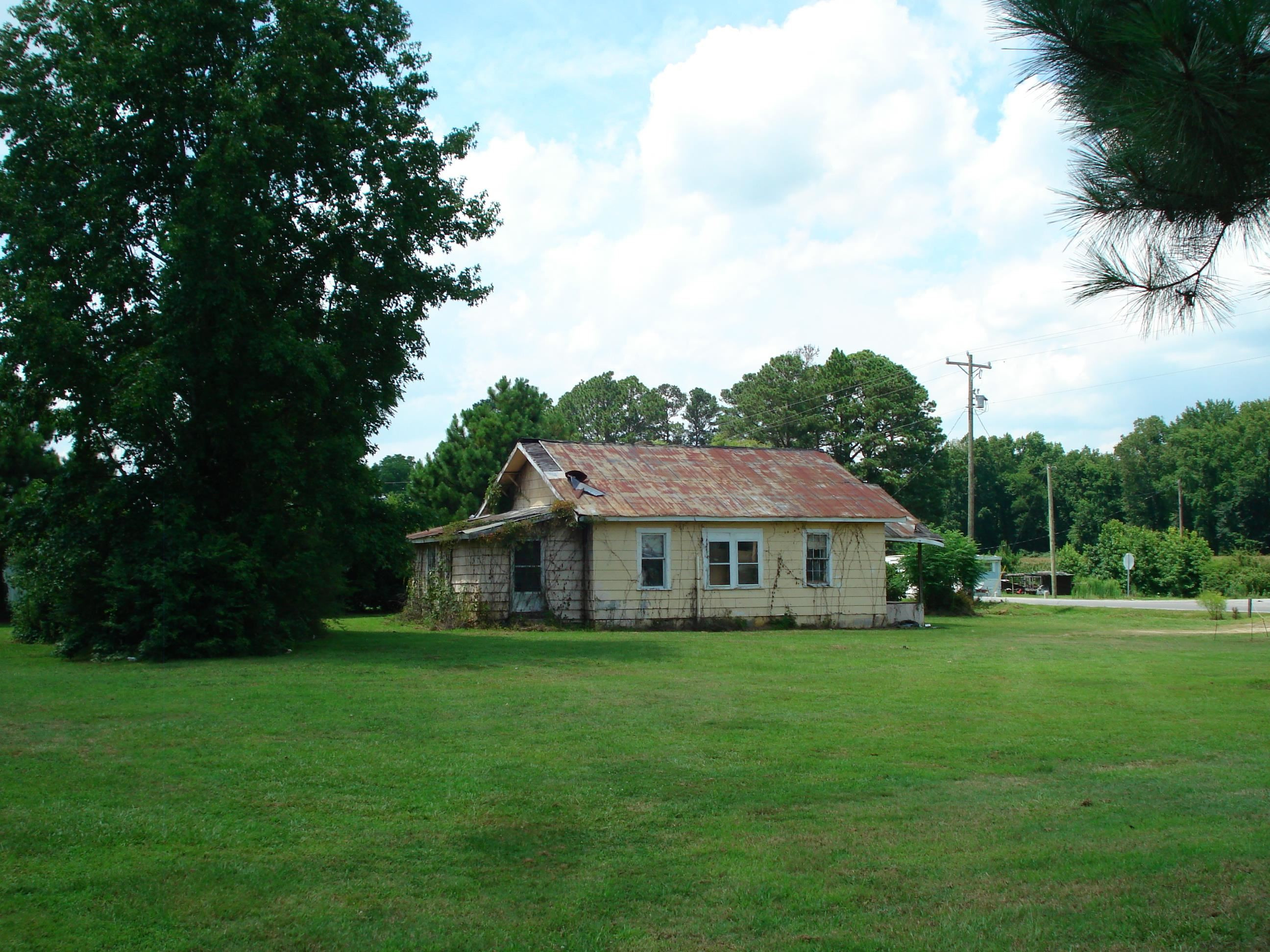 528 Long Branch Road Dunn, NC 28334 - Photo 11 of 27 a view of house with a garden