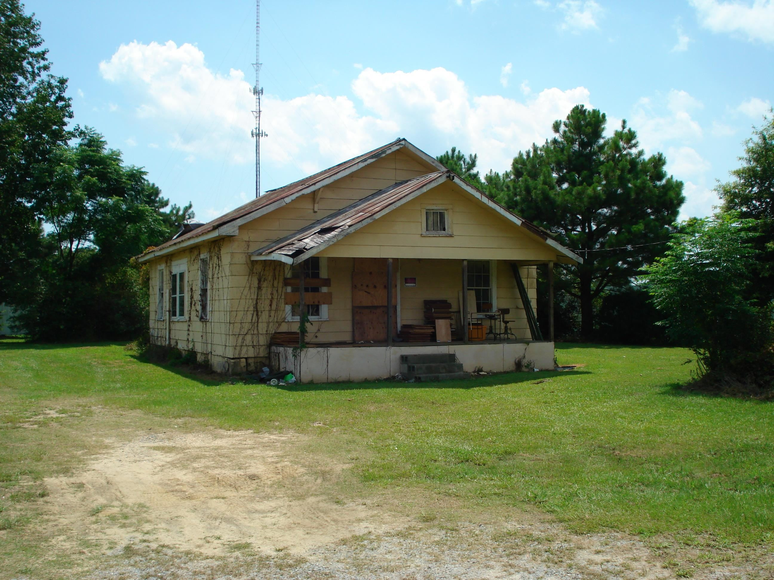 528 Long Branch Road Dunn, NC 28334 - Photo 12 of 27 a front view of house with yard and green space