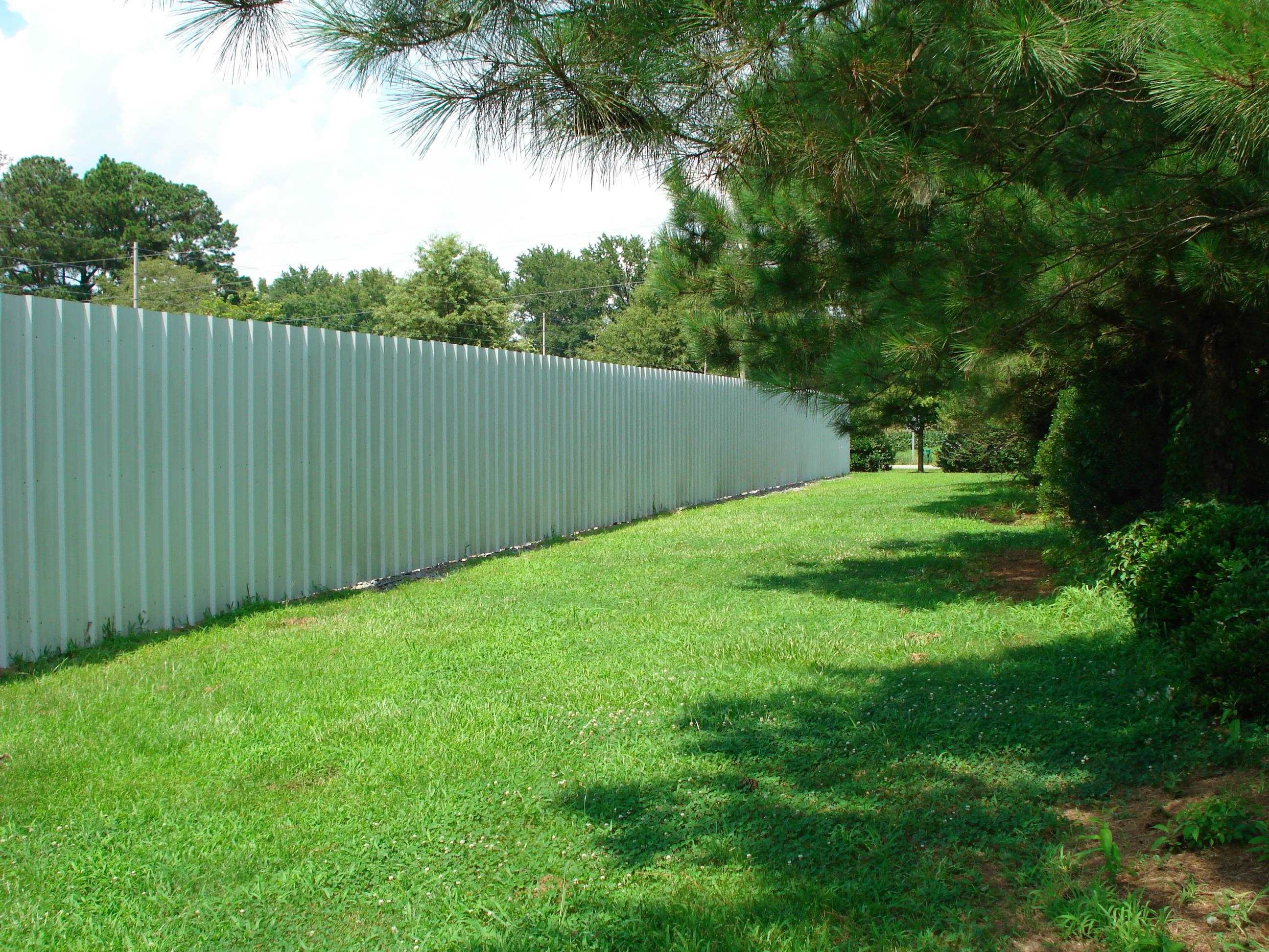 528 Long Branch Road Dunn, NC 28334 - Photo 14 of 27 a backyard of a house with lots of plants and palm trees