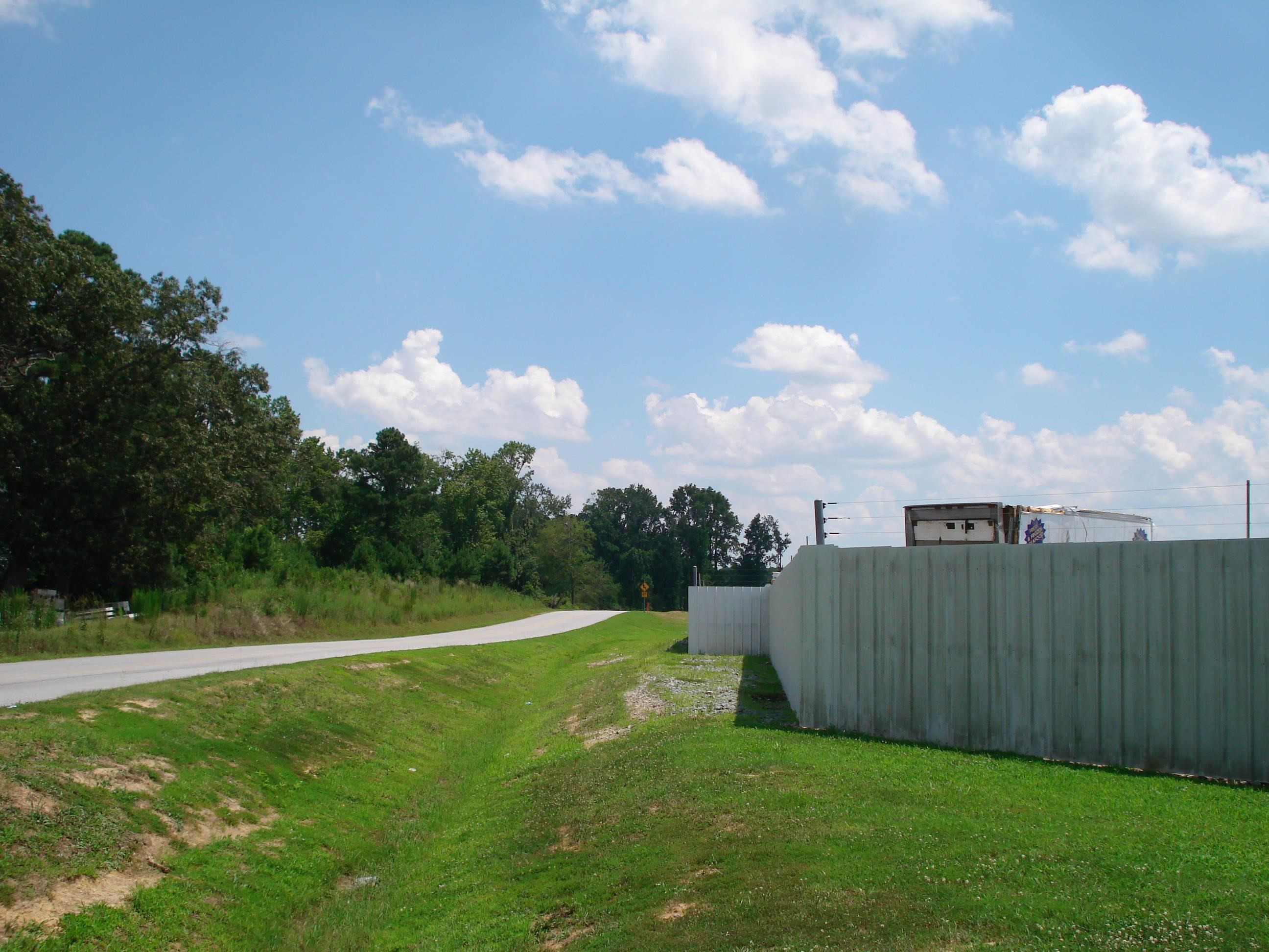 528 Long Branch Road Dunn, NC 28334 - Photo 21 of 27 a view of a golf course with a big yard