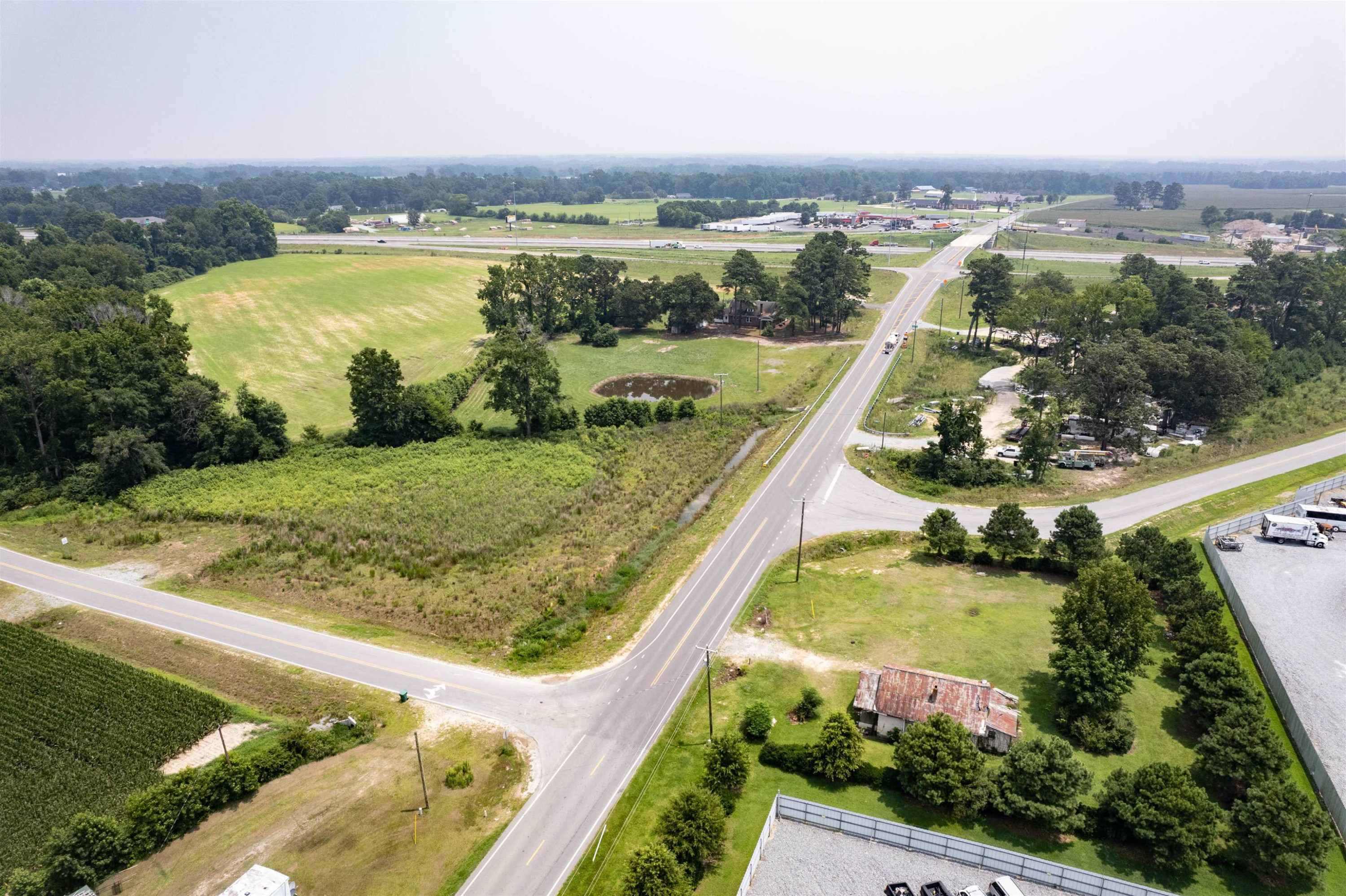 528 Long Branch Road Dunn, NC 28334 - Photo 23 of 27 an aerial view of lake residential house with outdoor space