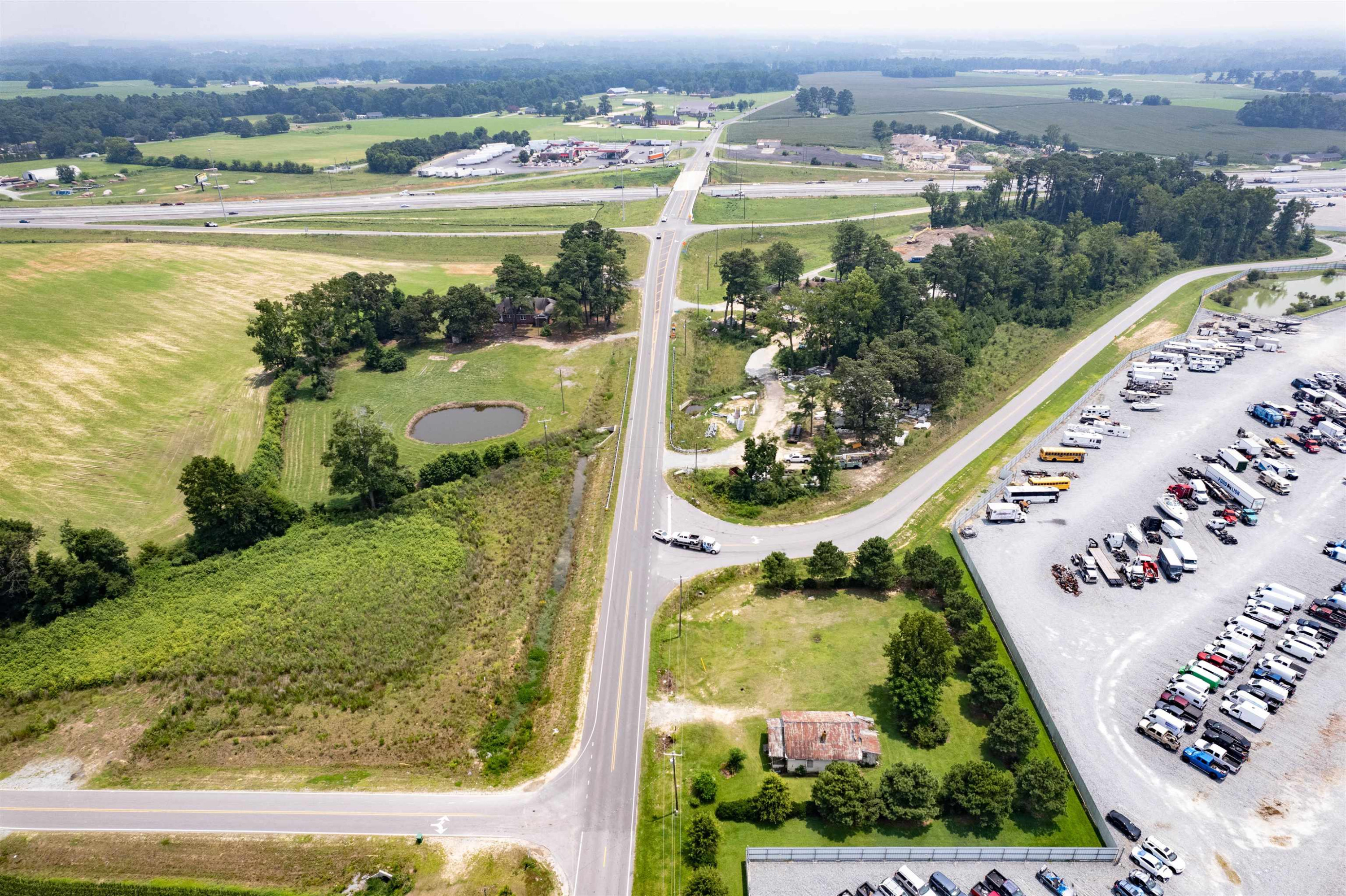 528 Long Branch Road Dunn, NC 28334 - Photo 27 of 27 an aerial view of lake and residential houses with outdoor space