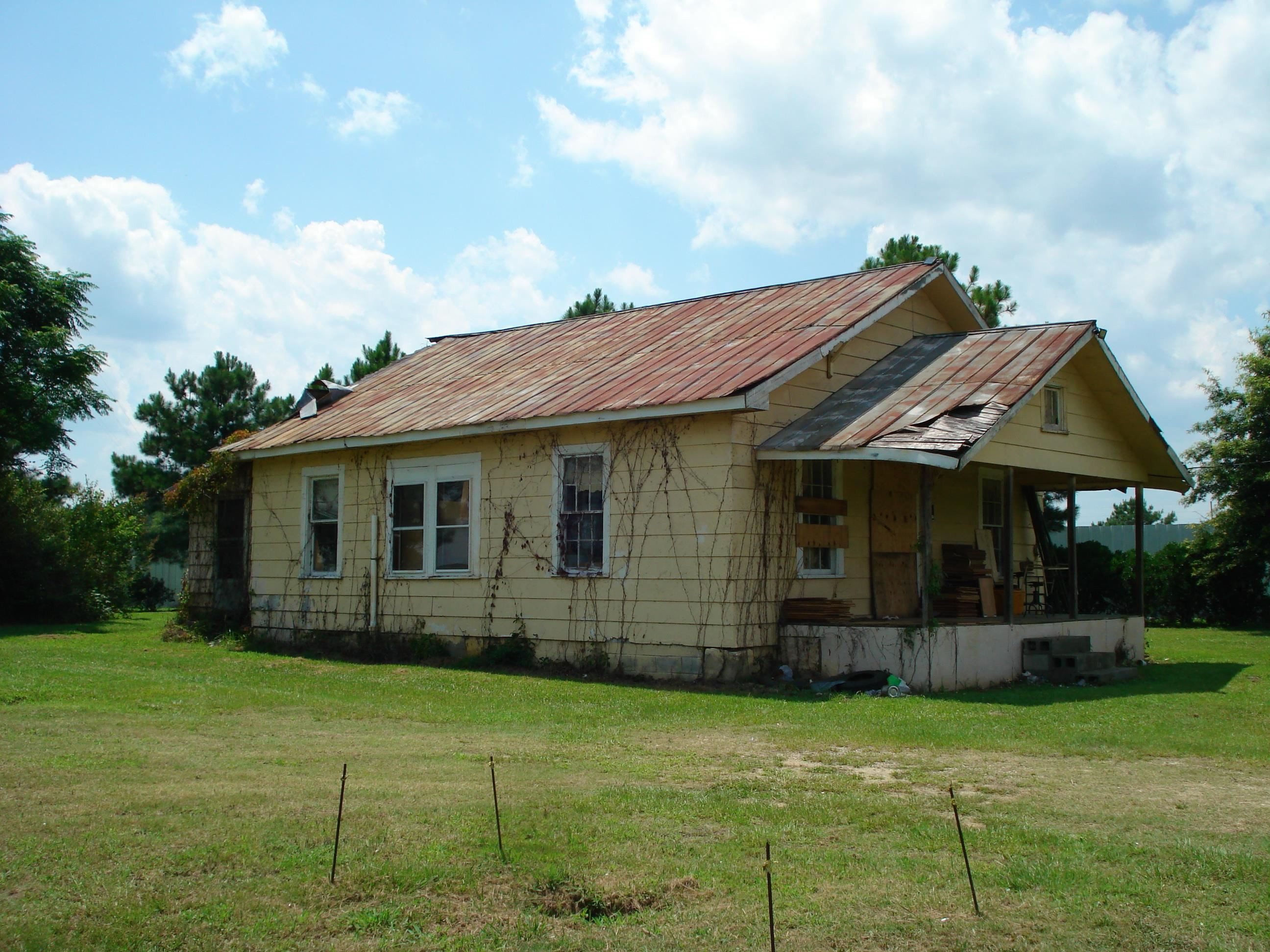 528 Long Branch Road Dunn, NC 28334 - Photo 8 of 27 a view of a house with a garden