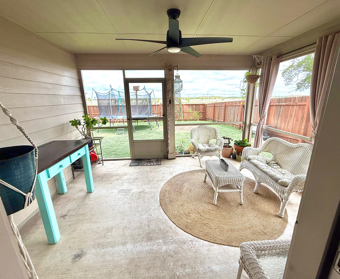 930 Pumpkin Ridge New Braunfels, TX 78130 - Photo 3 of 32 Screened porch featuring a ceiling fan with integrated lighting, concrete flooring, and direct access to the backyard