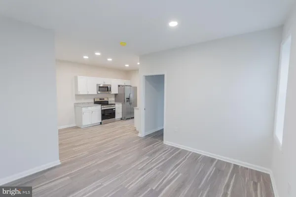 a view of kitchen with wooden floor