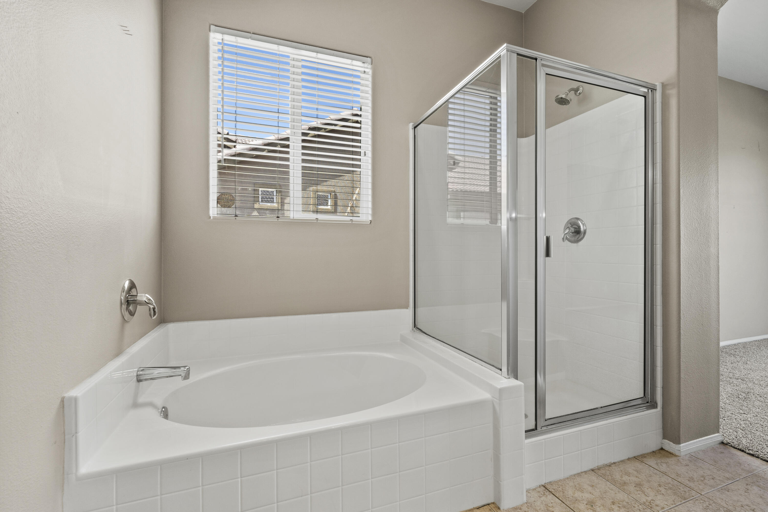 49418 Wayne Street Indio, CA 92201 - Photo 16 of 29 a white bath tub sitting next to a window