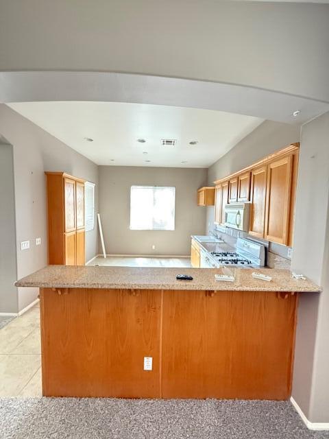 49418 Wayne Street Indio, CA 92201 - Photo 22 of 29 a view of kitchen island with granite countertop sink