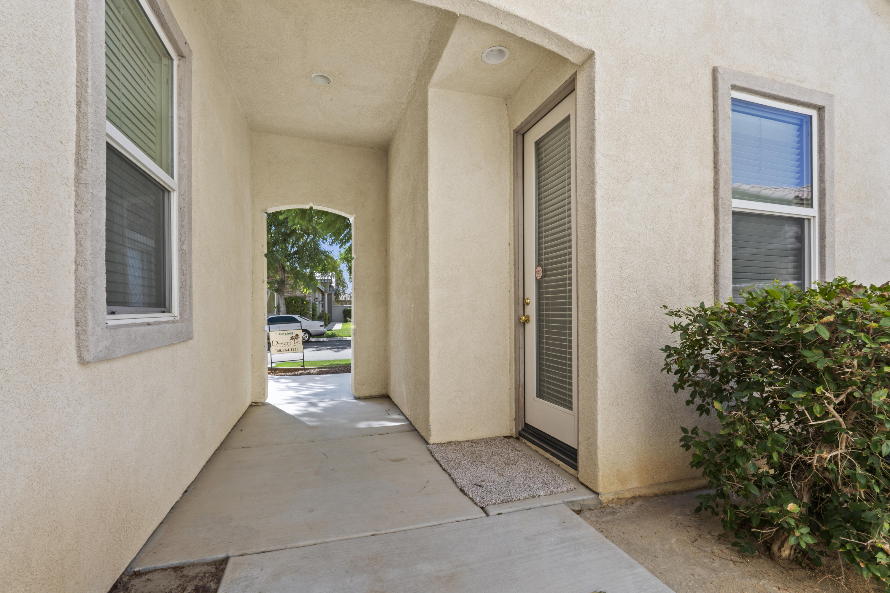 49418 Wayne Street Indio, CA 92201 - Photo 3 of 29 a view of entryway with garden