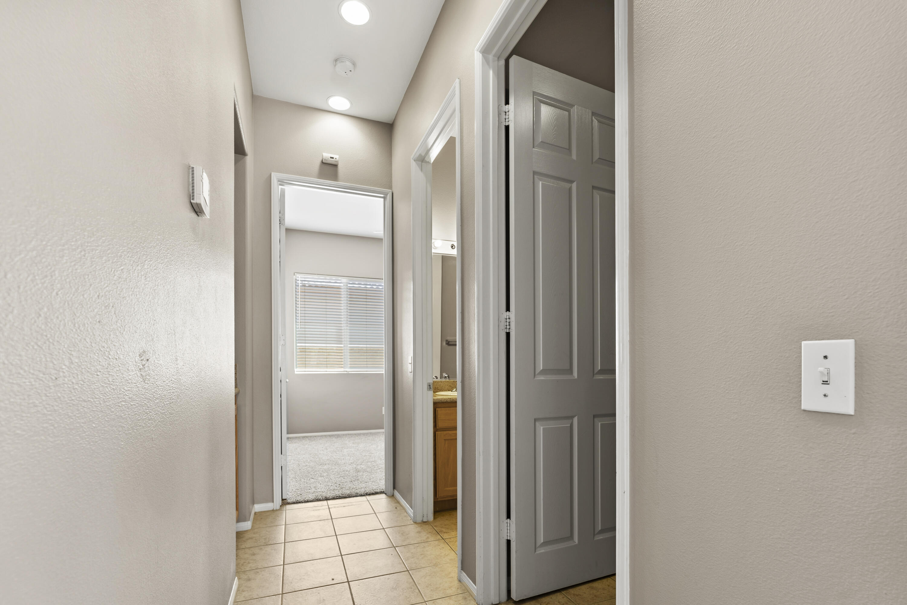 49418 Wayne Street Indio, CA 92201 - Photo 10 of 29 a bathroom with a glass shower door and a bathroom sink
