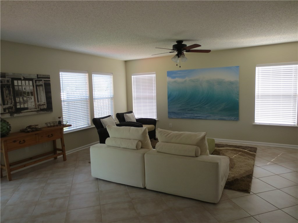 86063 Augustus Avenue Yulee, FL 32097 - Photo 11 of 20 a living room with furniture and a flat screen tv