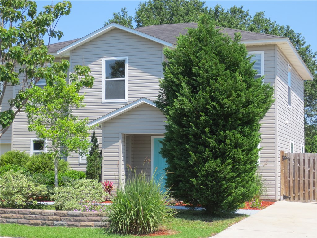 86063 Augustus Avenue Yulee, FL 32097 - Photo 3 of 20 front view of a house with a yard