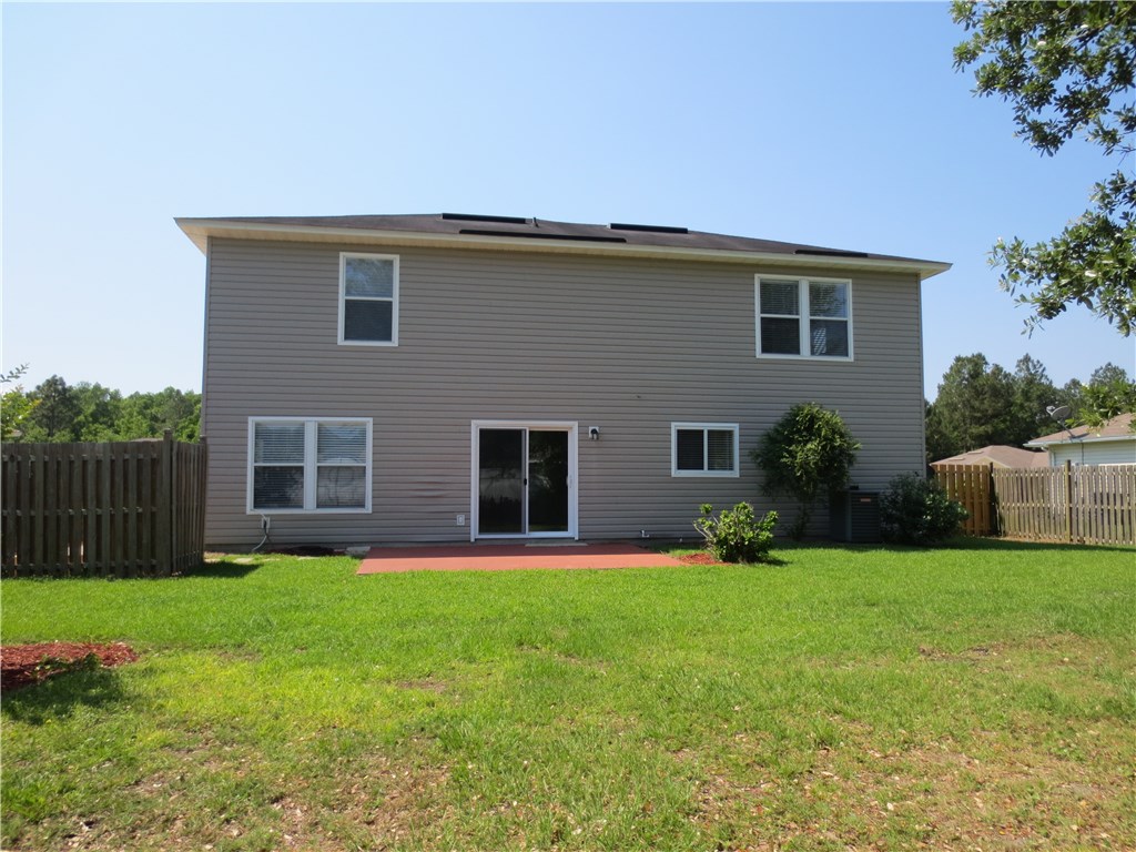86063 Augustus Avenue Yulee, FL 32097 - Photo 6 of 20 a house view with a sitting space and garden