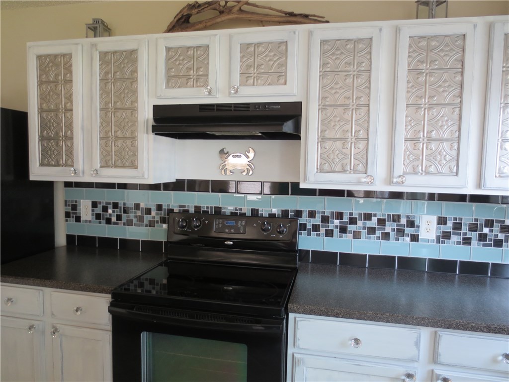 86063 Augustus Avenue Yulee, FL 32097 - Photo 10 of 20 a kitchen with stainless steel appliances a stove and a microwave